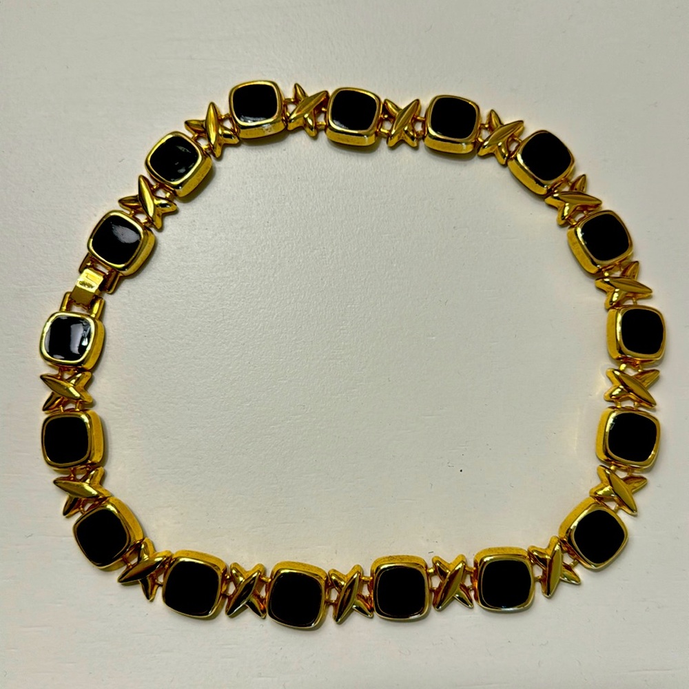 Black and gold tone necklace and bracelets
Sold as a set of 3